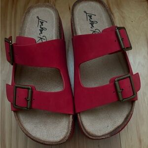EUC red wedge buckle slides. Size 7